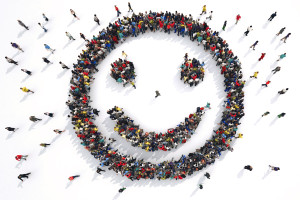 3D Rendering smiley face formed by groups of people